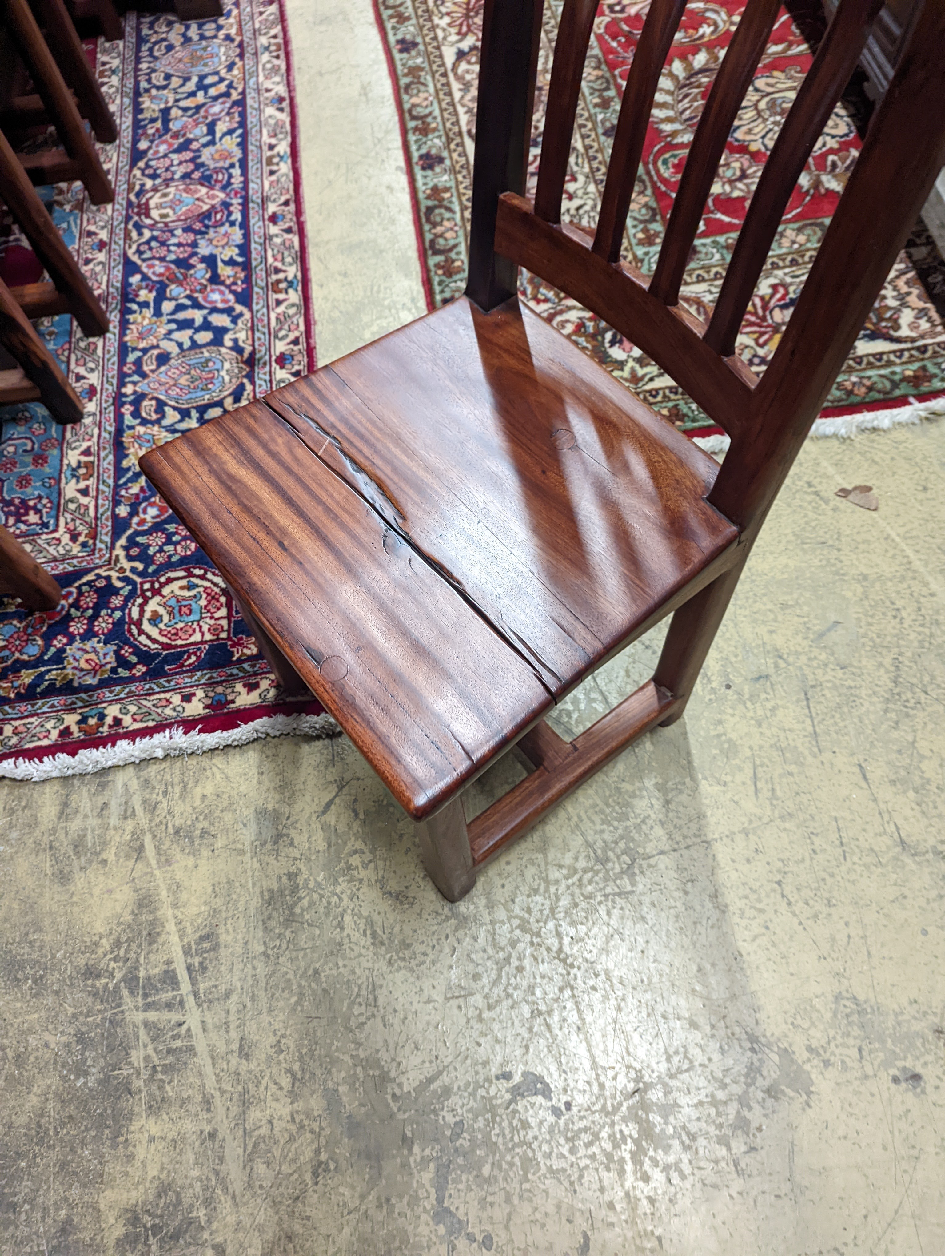 A South African distressed hardwood rectangular refectory dining table, length 200cm, depth 100cm, height 75cm and eight hardwood high back wood seat dining chairs